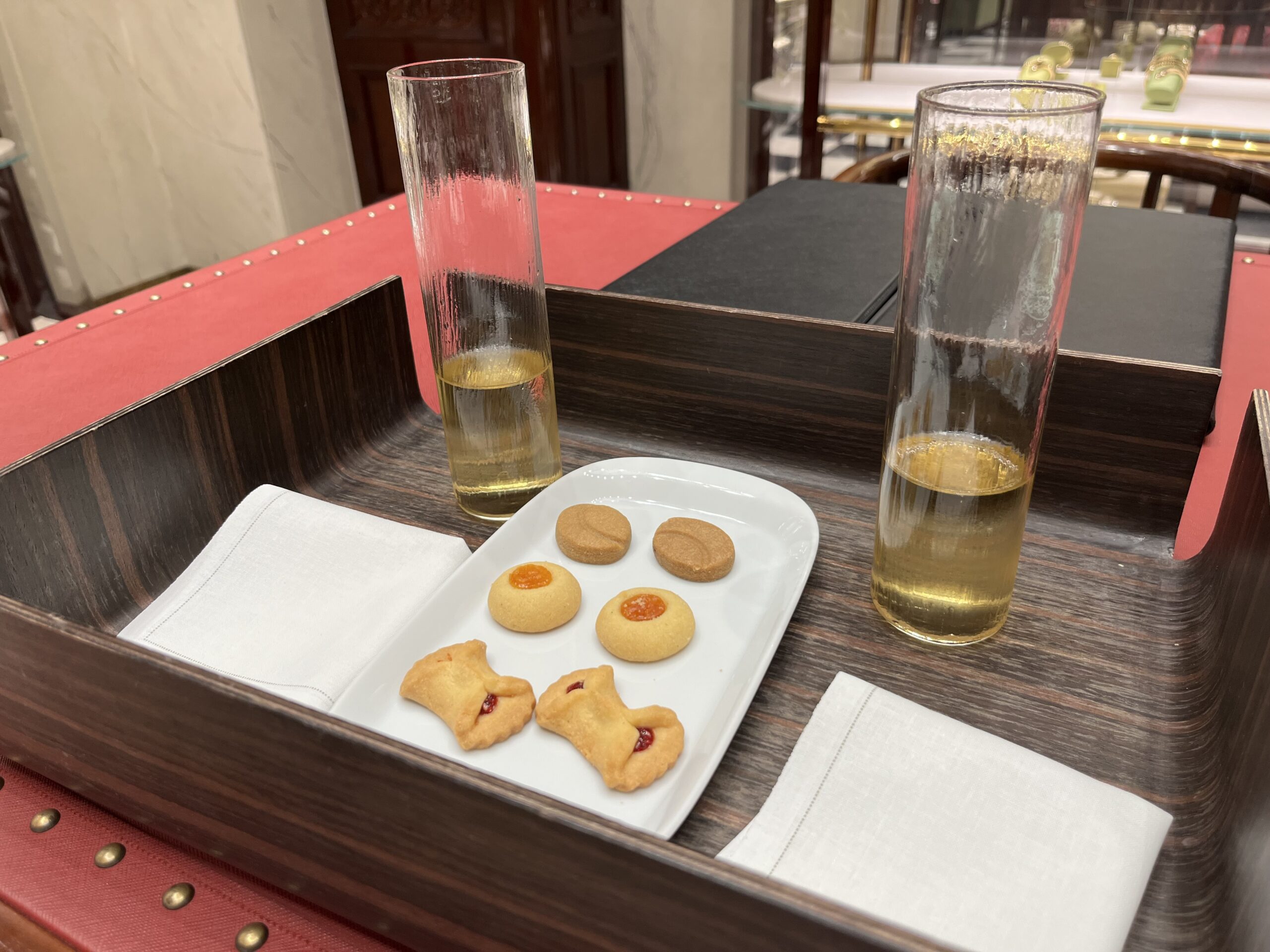 Champagne and cookies during appointment in Prada Milan